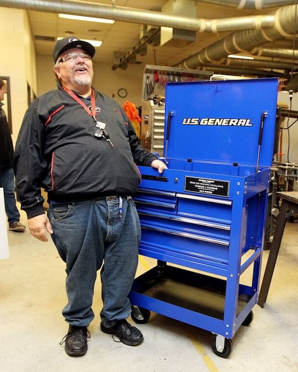 Charles Kachmar, who teaches metals and welding at Maxwell High School of Technology in Lawrenceville, was surprised in his classroom by a representative from Harbor Freight Tools for Schools with the news that he and his school will receive $100,000—$70,000 for the school’s skilled trades program and $30,000 for him. CONTRIBUTED