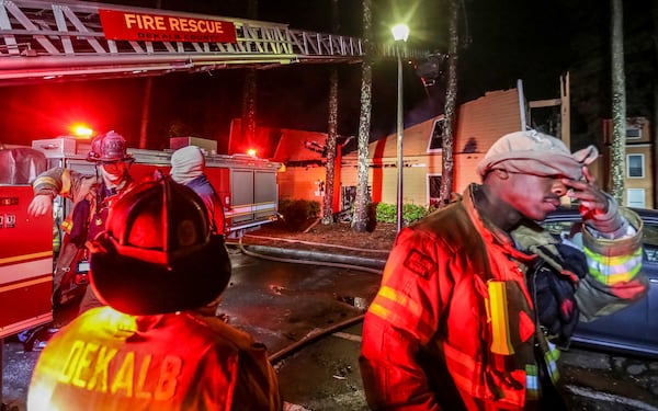 Atlanta firefighters poured water on a collapsed apartment building until daybreak in the 2000 block of Ficus Court in Stone Mountain Friday April 27, 2018. 