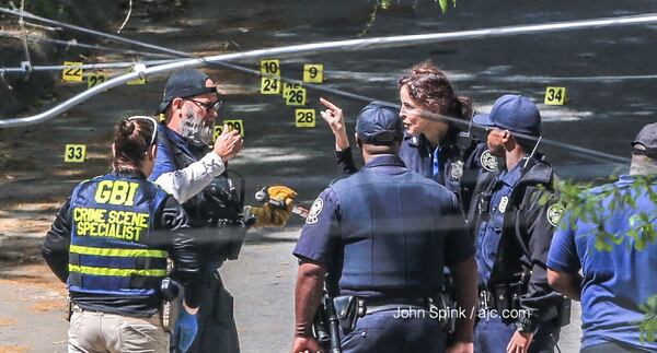 When the man finally exited the home, he confronted officers and refused commands to surrender. JOHN SPINK / JSPINK@AJC.COM