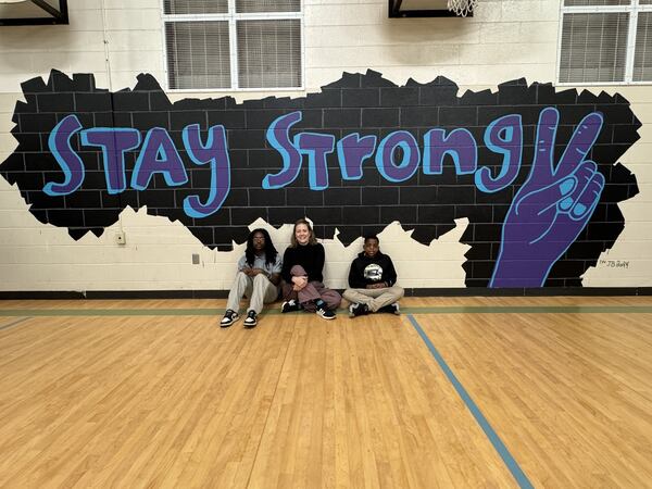 The middle school students worked with Erin Hawkins (center), Macon-based artist and founder of Mama Hawk Draws, for six weeks to do the mural. (Courtesy of Macon+Bibb County/Facebook)