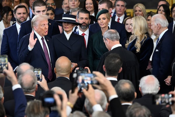 President-elect Donald Trump takes the oath of office during the 60th Presidential Inauguration in the Rotunda of the U.S. Capitol in Washington, Monday, Jan. 20, 2025. (Saul Loeb/Pool photo via AP)