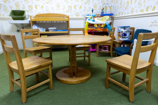 A children’s table made and signed by Jimmy Carter sits in Maranatha Baptist Church in Plains on Sunday, Feb. 26, 2023. (Arvin Temkar/AJC)