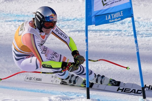 Germany's Emma Aicher speeds down the course of an alpine ski, women's World Cup super G race, in La Thuile, Italy, Thursday, March 13, 2025. (AP Photo/Piermarco Tacca)