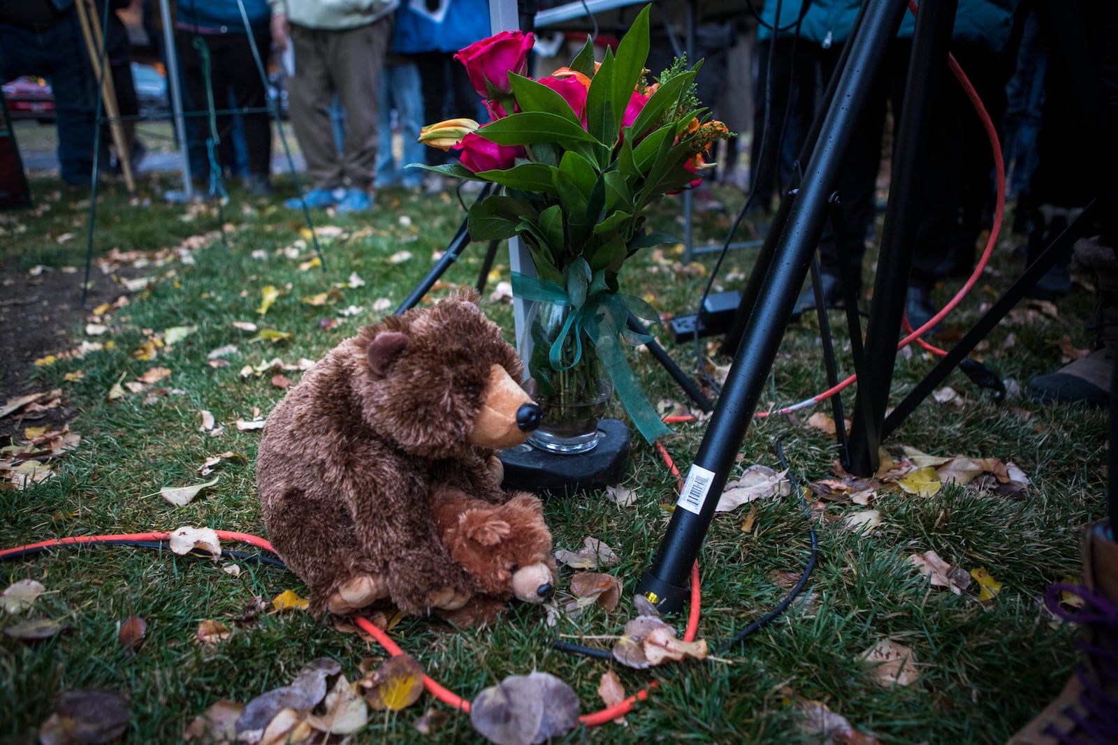 Teddy bears and flowers decorate a candlelight vigil in Jackson, Wyo., Saturday, Nov. 2, 2024. (AP Photo/Amber Baesler)