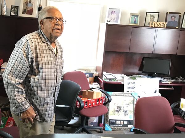 Thomas Livsey, the longtime “mayor” of the Promised Land, giving a reporter a tour of his office laden with with photos, souvenirs and other items that touch on the history of the area near Centerville. TYLER ESTEP / TYLER.ESTEP@AJC.COM