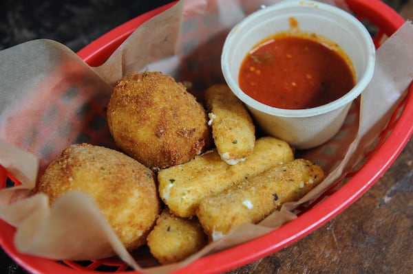 Rice balls with risotto, pecorino and mozzarella, homemade mozzarella sticks. (BECKY STEIN PHOTOGRAPHY)