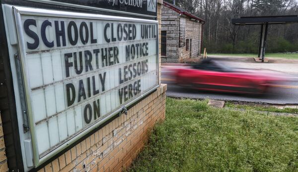 March 18, 2020: The outdoor sign at Murphey Candler Elementary School in Lithonia announces the school's closure during the first hectic weeks after COVID-19 was first detected in Georgia. (John Spink / AJC file photo 2020)