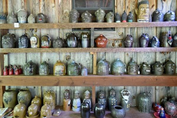 Lining up their creativity: Pottery by Tom and Judy Touchstone is displayed in their gallery in Armuchee, near Summerville. HYOSUB SHIN / HSHIN@AJC.COM