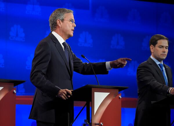 Jeb Bush, left, speaks as Marco Rubio looks on during the CNBC Republican presidential debate at the University of Colorado, Wednesday, Oct. 28, 2015, in Boulder, Colo. (AP Photo/Mark J. Terrill)