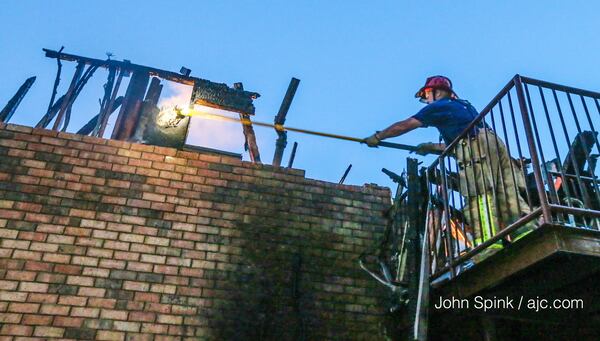 Crews fought a blaze that displaced 19 people in DeKalb County. JOHN SPINK / JSPINK@AJC.COM