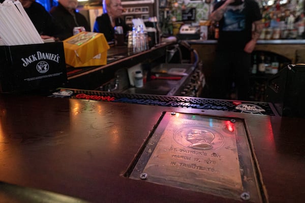 A plaque commemorating where Jimmy Carter stood is embedded into the counter of Pinkie Masters bar in Savannah, GA on December 23, 2024. In March of 1978, Carter stood on the location of the plaque and gave a eulogy to the bars former owner. (Justin Taylor/The Atlanta Journal-Constitution)