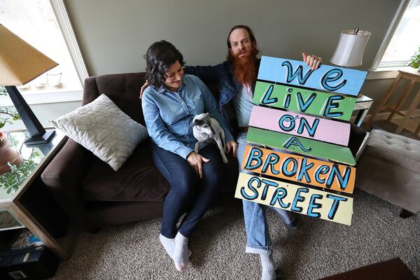 Kyle Brooks at home with his wife, Maria Villamarzo, in 2017. The couple live in Lithonia with their 16-month-old son, Teddy. CURTIS COMPTON / CCOMPTON@AJC.COM