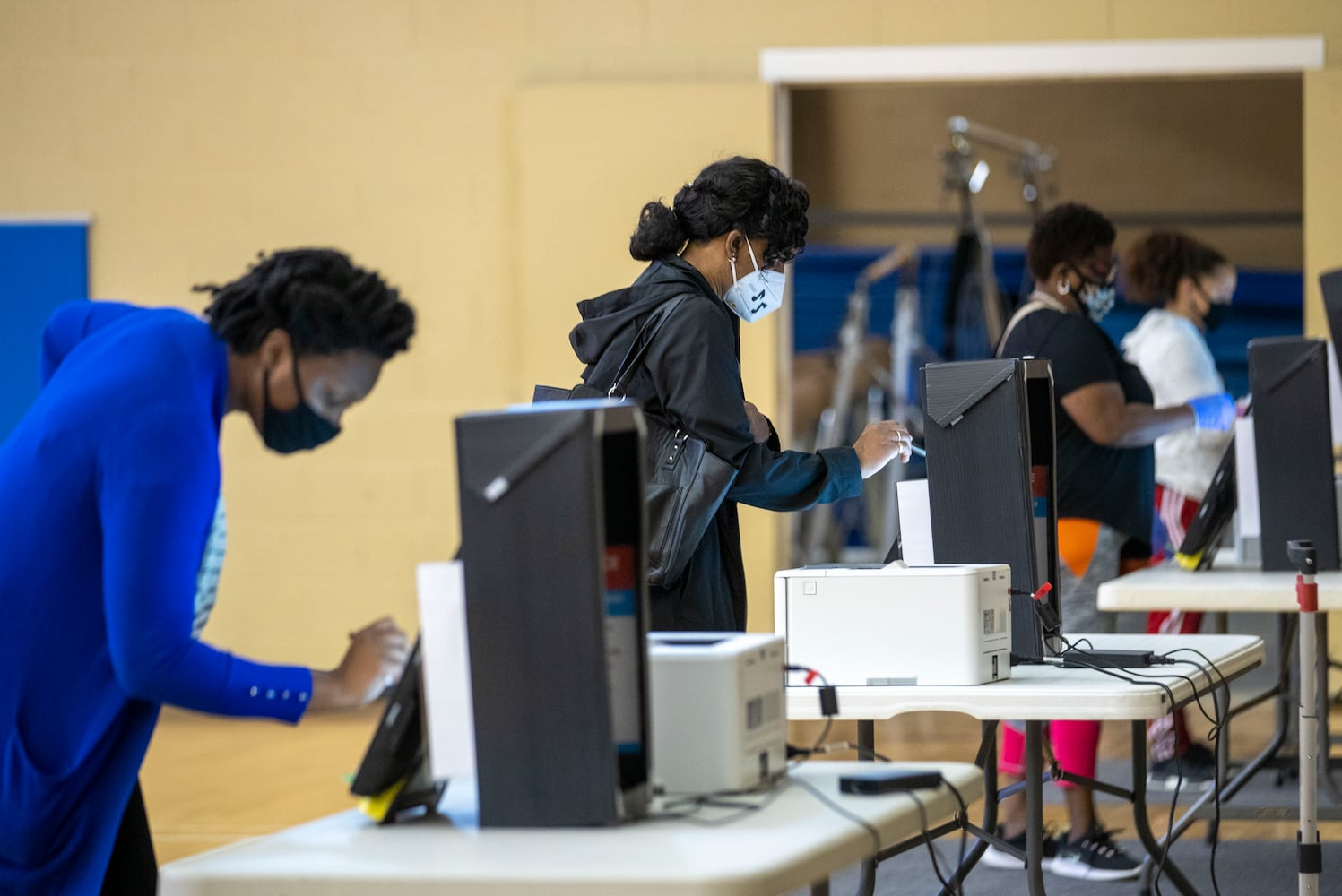 PHOTOS: Georgia voters struggle with long lines, new equipment, social distancing