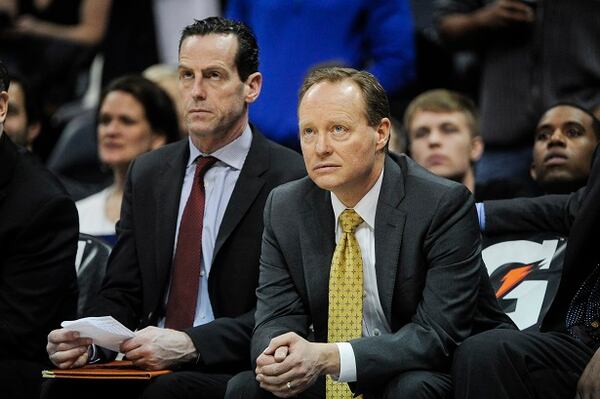 Atlanta Hawks coach Mike Budenholzer, right, watches the final moments of an NBA basketball game against the Toronto Raptors, Friday, Feb. 20, 2015, in Atlanta. Toronto won 105-80. (AP Photo/John Amis) Coach Bud is not impressed with what he sees. (AP photo/John Amis)