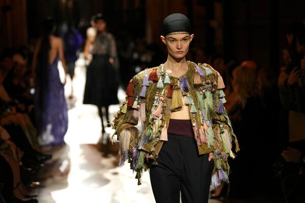 A model wears a creation as part of the Dries Van Noten Fall/Winter 2025-2026 Womenswear collection presented in Paris, Wednesday, March 5, 2025. (Photo by Scott A Garfitt/Invision/AP)