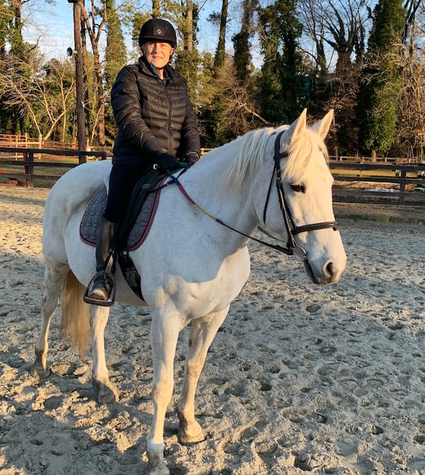 Jane Donofrio on her mare, Gracie, a Percheron-Arabian cross she boards at Little Creek Farm Conservancy.