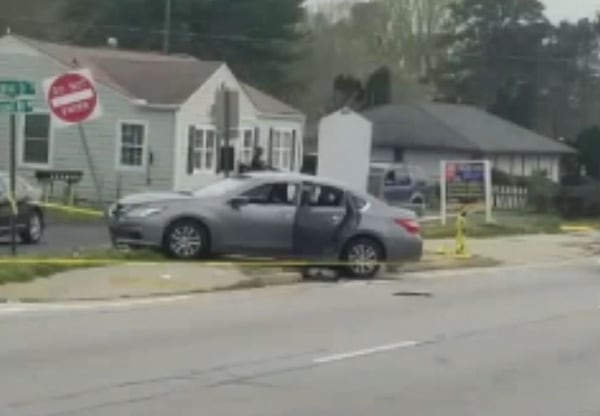 Car crashes into do not enter sign