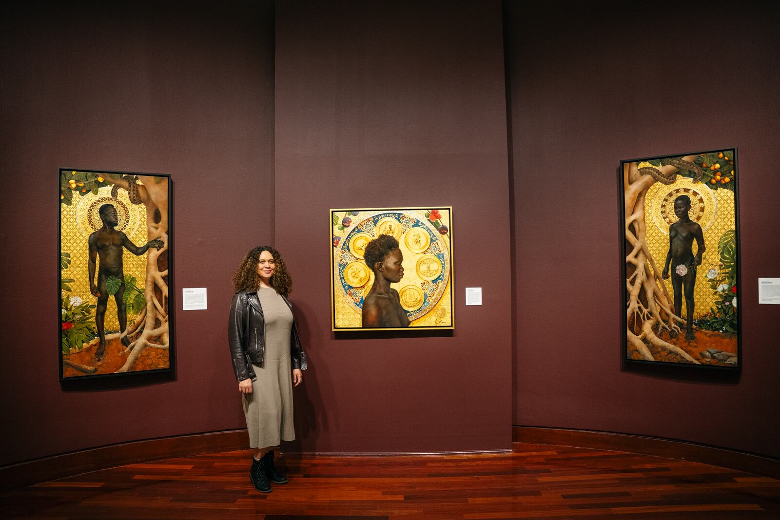 Spelman College Executive Directer of the Museum of Fine Art, Liz Andrews, showcases Afro-Cuban Harmonia Rosales' Master Narrative exhibit on display though November in Atlanta, Georgia on Tuesday, Nov. 28, 2023. (Olivia Bowdoin for the Atlanta Journal-Constitution).  