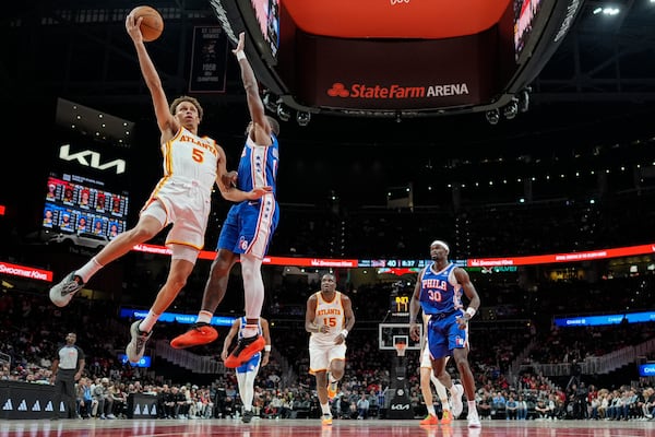 Atlanta Hawks guard Dyson Daniels (5) heads to the basket against the Philadelphia 76ers during the first half of an NBA basketball game, Monday, March 10, 2025, in Atlanta. (AP Photo/Mike Stewart)