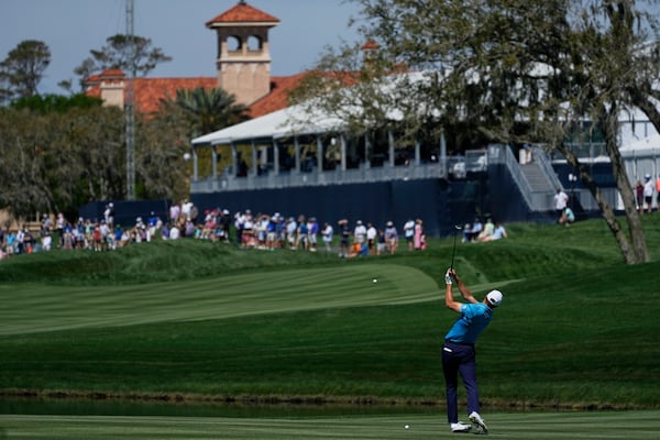 Jordan Spieth hits his second shot on the ninth hole during the first round of The Players Championship golf tournament Thursday, March 13, 2025, in Ponte Vedra Beach, Fla. (AP Photo/Julia Demaree Nikhinson)