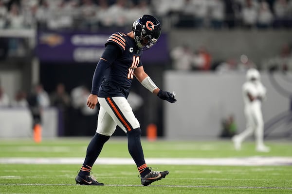 Chicago Bears quarterback Caleb Williams walks off the field after an incomplete third down pass during the first half of an NFL football game against the Minnesota Vikings, Monday, Dec. 16, 2024, in Minneapolis. (AP Photo/Abbie Parr)