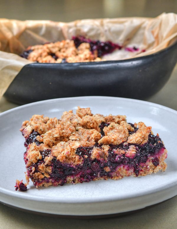 The recipe for Deep South Blueberry Cobbler uses maple syrup in its filling and its crust. (Styling by Nichole Dandrea-Russert / Chris Hunt for the AJC)