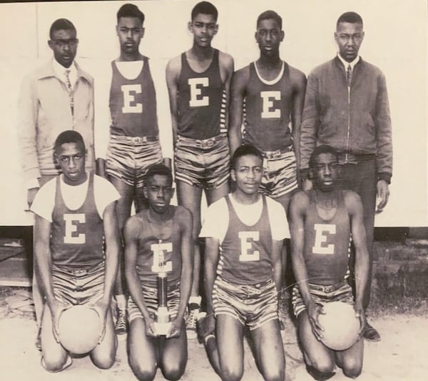 Eatonton Colored High School's basketball team won a GIA championship in 1949-50. Pictured are (front row, from left) Herbert Stokes, J.W. Freeman, Frederick Griffith, Charles Freeman and (back row, from left) coach Odell Owens, Willie Frank Daniel, James Few, Roy Little and principal W.N. McGlockton. Freeman, now 91, is featured in the GPB documentary "As If We Were Ghosts."