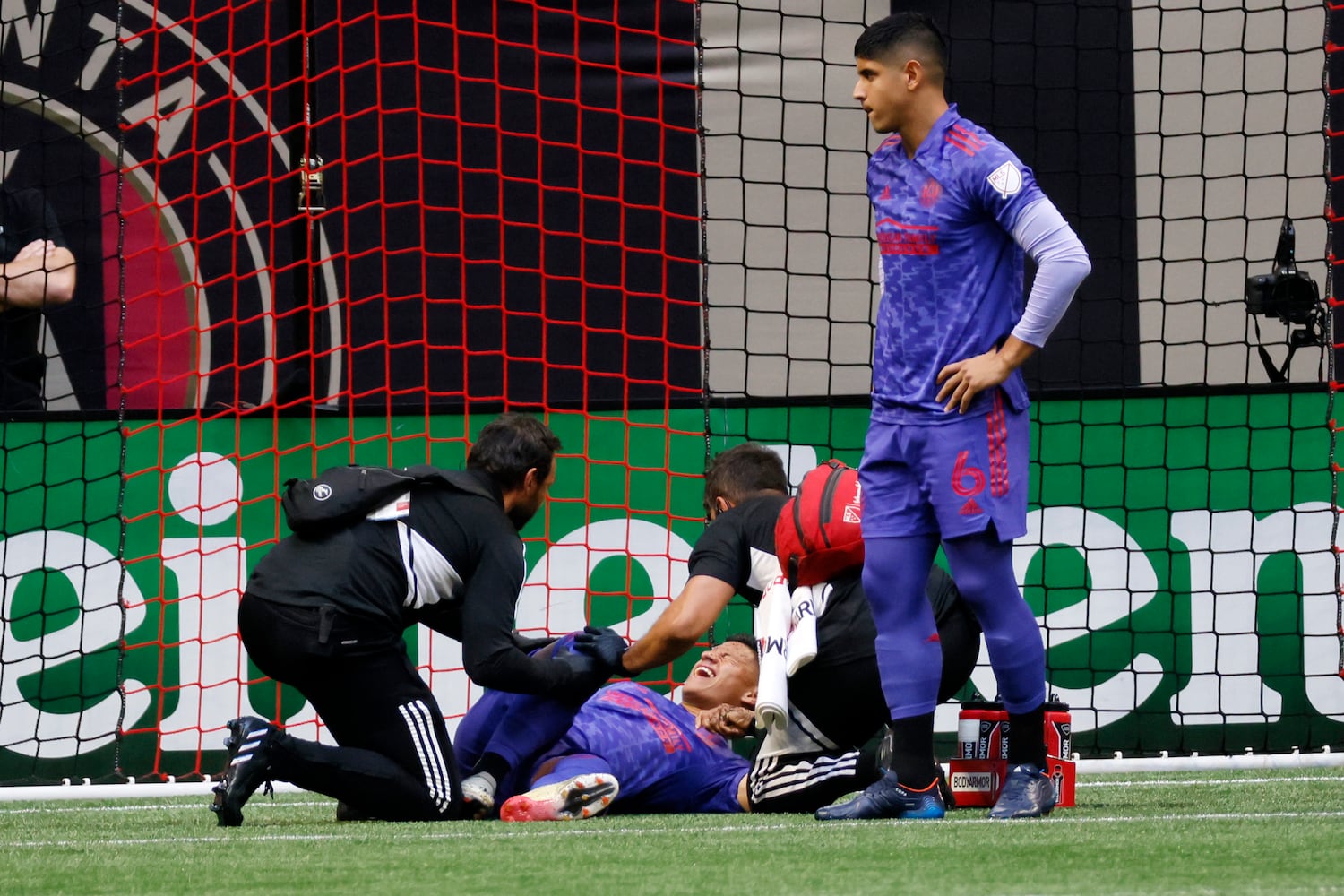 Atlanta United Ronald Hernandez lies in pain after a play in the minute one in the first half of an MLS soccer match at Mercedes-Benz Stadium on Saturday, May 28, 2022. Miguel Martinez / miguel.martinezjimenez@ajc.com