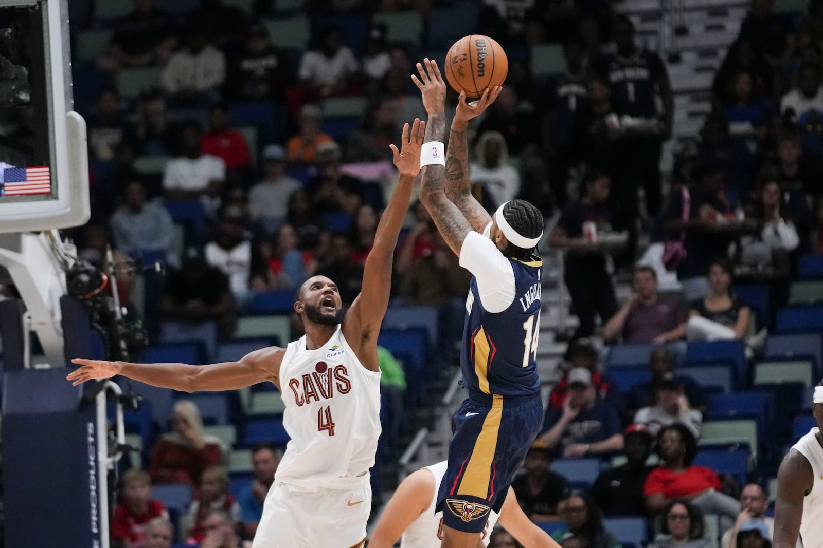 New Orleans Pelicans forward Brandon Ingram (14) shoots against Cleveland Cavaliers forward Evan Mobley (4) in the first half of an NBA basketball game in New Orleans, Wednesday, Nov. 6, 2024. (AP Photo/Gerald Herbert)