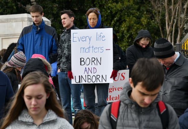 Anti-abortion supporters bow for a prayer during the January 2020 Georgia March For Life & Memorial Service to raise awareness and support of anti-abortion legislation. (Hyosub Shin / Hyosub.Shin@ajc.com)