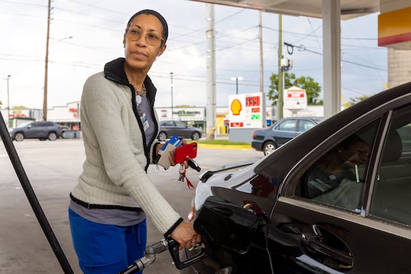 Rosey Jean-Baptiste pumped gas in Decatur earlier this year. (Arvin Temkar/arvin.temkar@ajc.com)