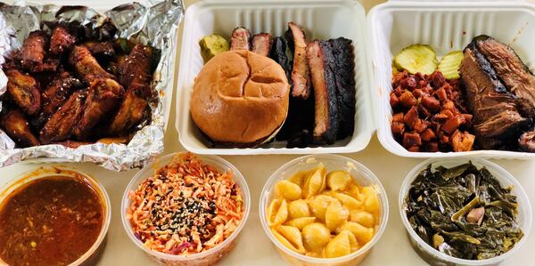 Boxed takeout from Heirloom Market BBQ includes wings, ribs, Korean spicy pork and brisket, plus sides. CONTRIBUTED BY WENDELL BROCK