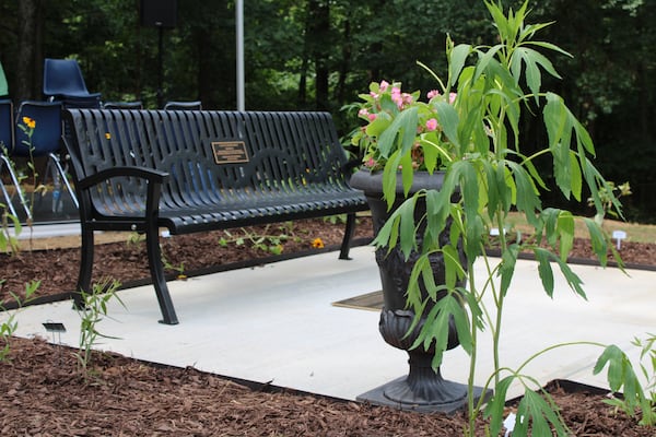 The Toni Morrison Society's 34th Bench by the Road located in Cobb County honors the history of enslaved and freed Black people in Cobb in the Concord Covered Bridge Historic District on Tuesday, June 18, 2024. The bench is surrounded by Matilda's Garden, named for a former slave identified from the area. (Taylor Croft/taylor.croft@ajc.com)