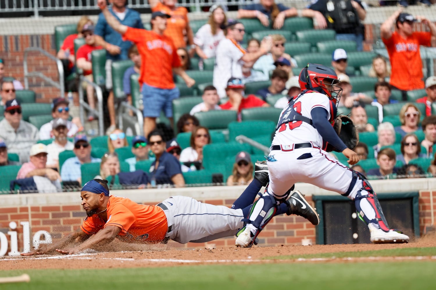 Astros' Corey Julks scores on a single from Alex Bregman in the top of the ninth inning to win the game against the Braves 5-2 at Truist Park on Sunday, April 23, 2023, in Atlanta. 
Miguel Martinez / miguel.martinezjimenez@ajc.com 