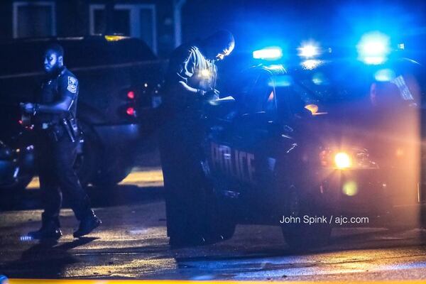 DeKalb police investigated the shooting at the 1310 Apartment Homes in the 4800 block of Wood Bend Drive. Photo: JOHN SPINK / JSPINK@AJC.COM