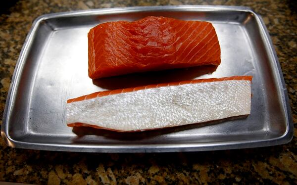 Chief fishmonger Francisco Hernandez broke down this Columbia River king salmon on April 20, 2017 at Providence in Los Angeles, Calif. (Francine Orr/Los Angeles Times/TNS)