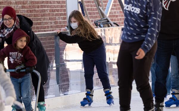 Seven-year-old Autumn uses the railing to stay upright as she skates around the Have an Ice Day rink in downtown Sugar Hill on Saturday afternoon, December 26, 2020. (Photo: Ben Gray for The Atlanta Journal-Constitution)
***EDNOTE: MOM ASKED THAT WE JUST USE HER FIRST NAME***