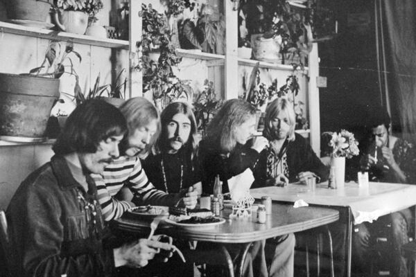 This undated photo, likely from 1970-71, shows members of the Allman Brothers Band, from left, Dickey Betts, Duane Allman, Berry Oakley, Butch Trucks, Gregg Allman and Jai Johanny "Jaimoe" Johanson, eating at the H&H Restaurant in downtown Macon. (The Macon Telegraph via AP, File)