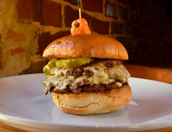 The patties cook quickly when you're making Local Republic’s Pepper Jack Loves Fraggle Rock Smash Burger. (Styling by chef Brian Hill / Chris Hunt for the AJC)