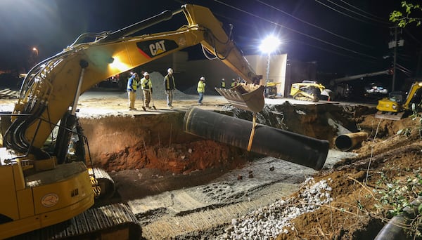 Crews were hard at work on March 8, 2018, to restore water services in Doraville in DeKalb County after a 48-inch water main broke on the previous day, disrupting a multitude of services across the county, including hospitals, businesses, restaurants and schools. 