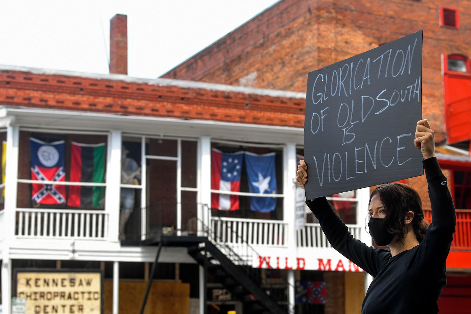 Dozens call for closure of Wildman’s Confederate memorabilia store in Kennesaw