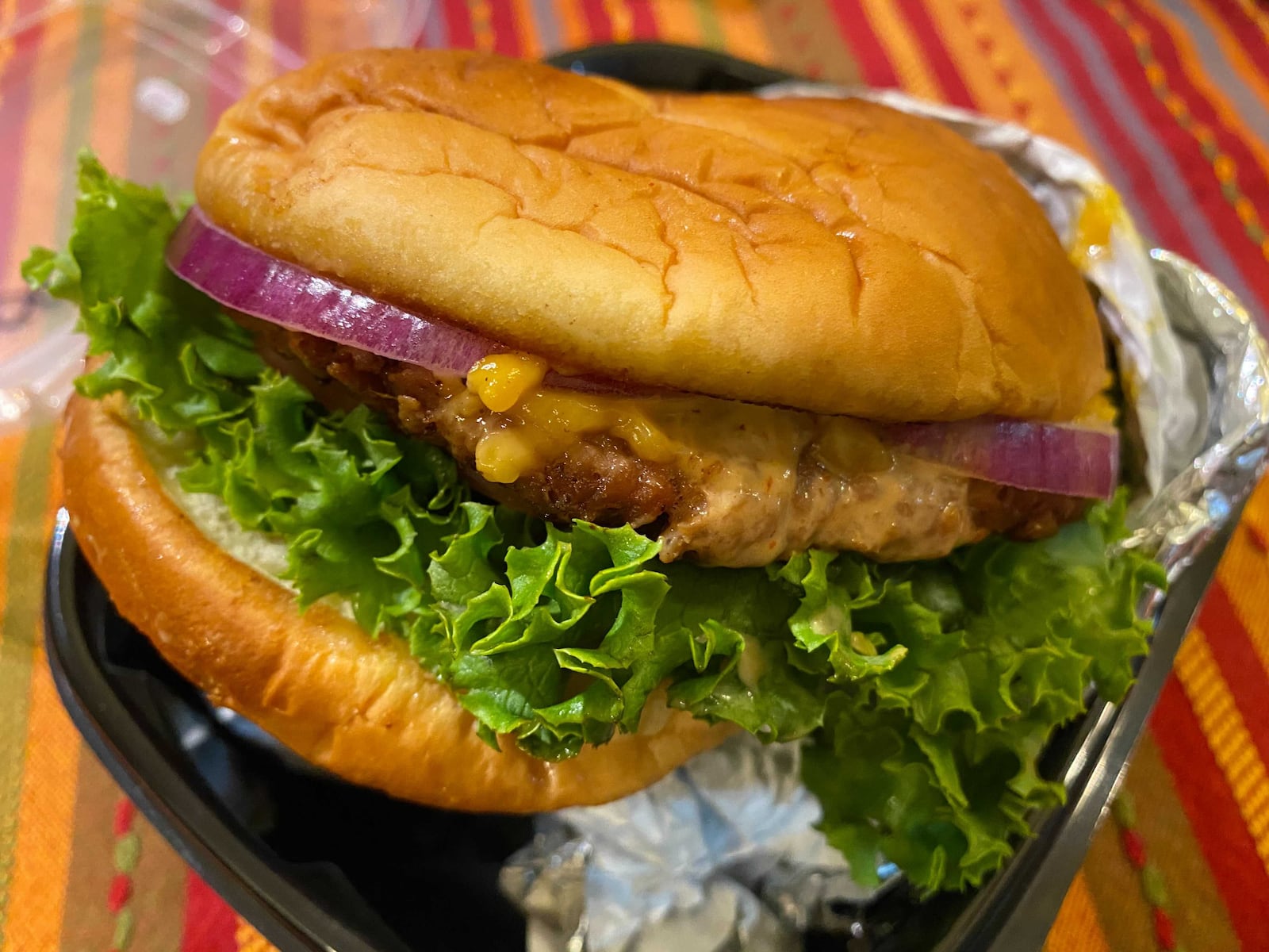 The Good as Burgers OG Burger is made with Beyond Meat and Violife cheese. Ligaya Figueras/ligaya.figueras@ajc.com