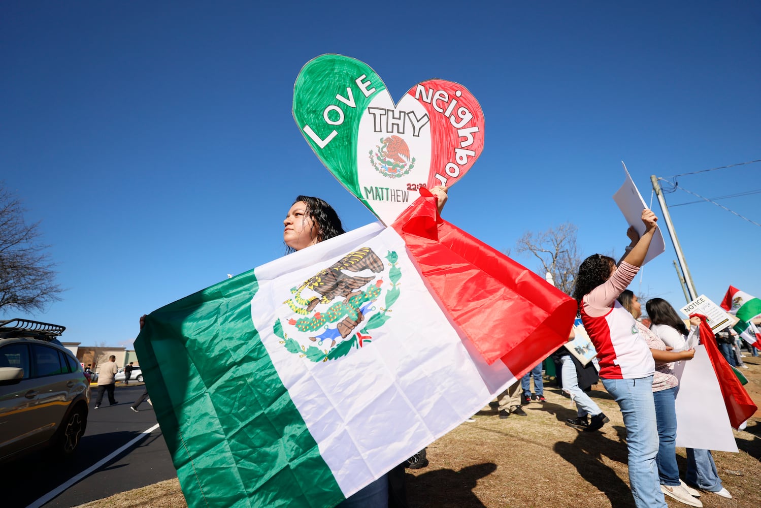 Vanesa Uscanga from Newnan, GA, holds a Mexican flag as she joins the pro-immigrant rally at Plaza Fiesta on Saturday, Feb. 1, 2025.
(Miguel Martinez/ AJC)