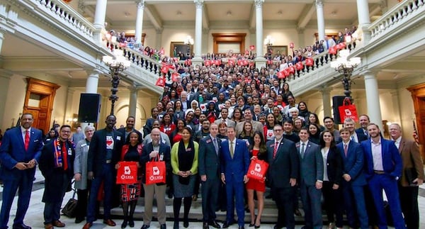 Gov. Brian Kemp posing with former refugees at a “new Americans” celebration at the state Capitol on Valentine’s Day last February. Photo by  Joseph McBrayer for the Coalition of Refugee Service Agencies.