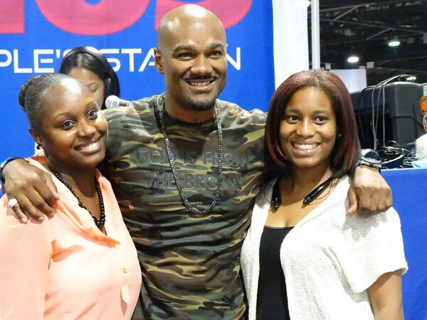 Big Tigger of V-103 with fans from Dallas Taneshae Critten and Courtney Tullis (right) CREDIT: Rodney Ho