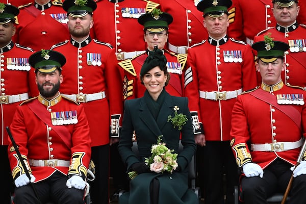 Britain's Kate, the Princess of Wales, poses for a photo with the Irish Guards, at a special St Patrick's Day parade and celebration at Wellington Barracks in London, Monday, March 17, 2025. (Eddie Mulholland/Pool photo via AP)