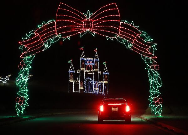 A motorist drives through some of the Magical Nights of Lights, Margaritaville at Lanier Islands. Curtis Compton/ccompton@ajc.com