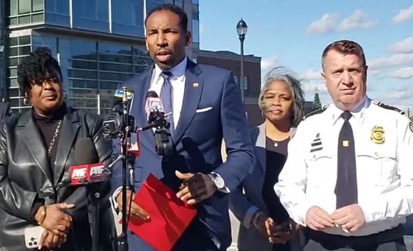 Atlanta Mayor Andre Dickens, joined by Atlanta Public Schools Superintendent Lisa Herring (left) and Atlanta Police Chief Darin Schierbaum last November discussing a shooting that occurred near Atlantic Station. The shooting resulted in the deaths of a 12-year-old and a 15-year-old. Six young people have been arrested in connection to the shooting, including a pair of  whose arr15-year-olds whose arrests were announced this week.