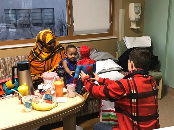  Tom Holland presents a Spider-Man toy to a young patient. Photos provided to the AJC by Allied Integrated Marketing and used with permission.