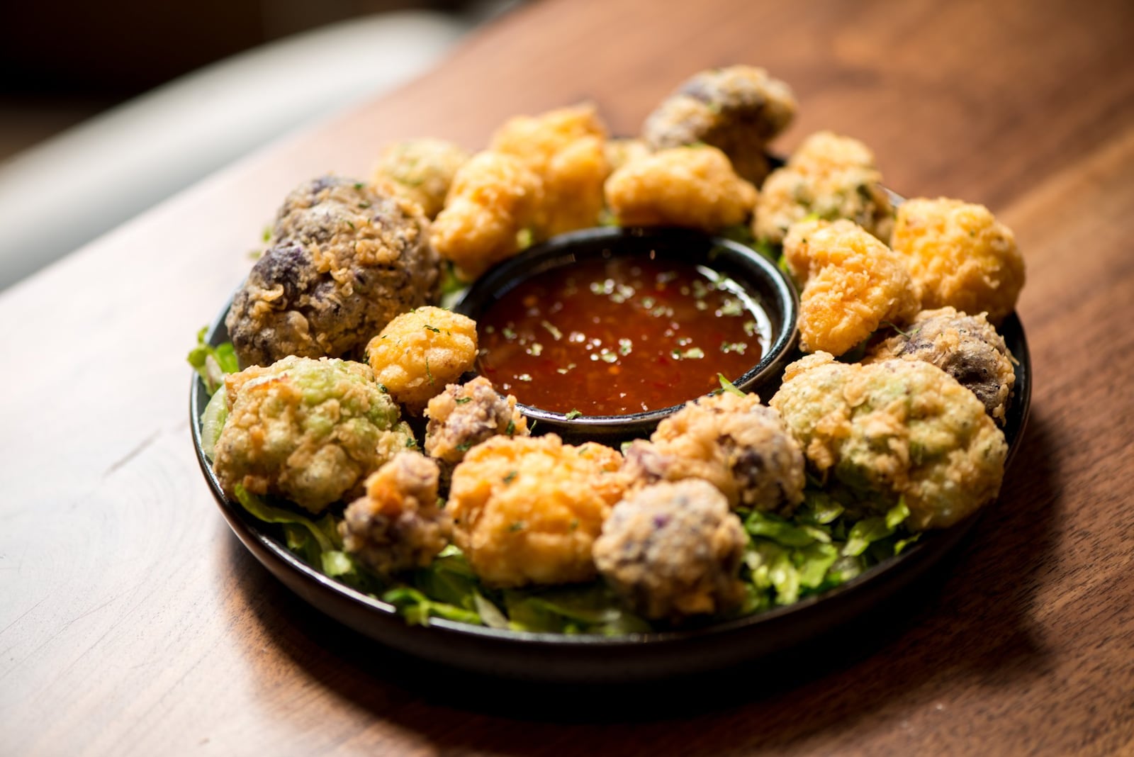 ellaship Crispy Blooming Cauliflower, flour-dusted, lightly fried and sweet chili sauce. Photo credit- Mia Yakel.